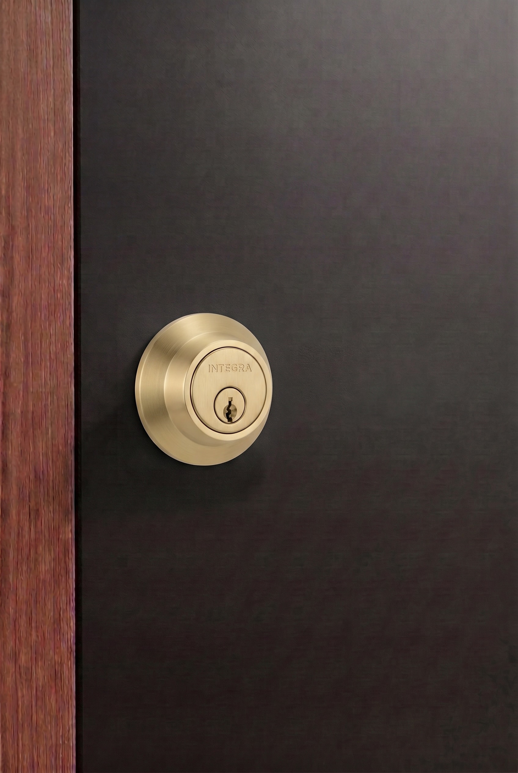 Round single cylinder deadbolt in brushed brass